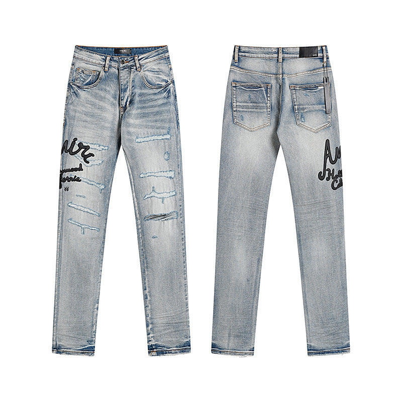 Men's Luxury Light Blue Shredded Distressed Jeans with Black Cursive Patchwork